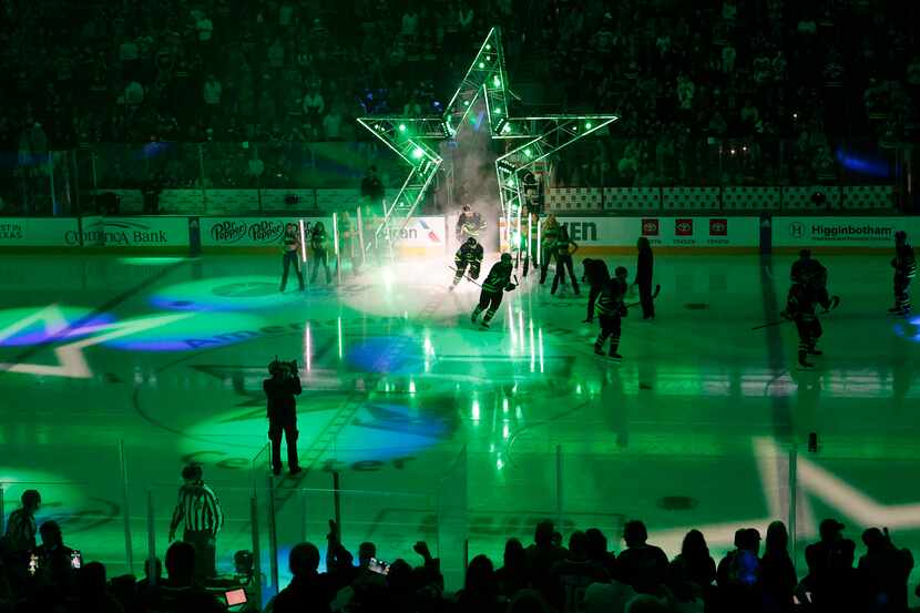 Dallas Stars players come out during introductions before an NHL hockey game New Jersey...