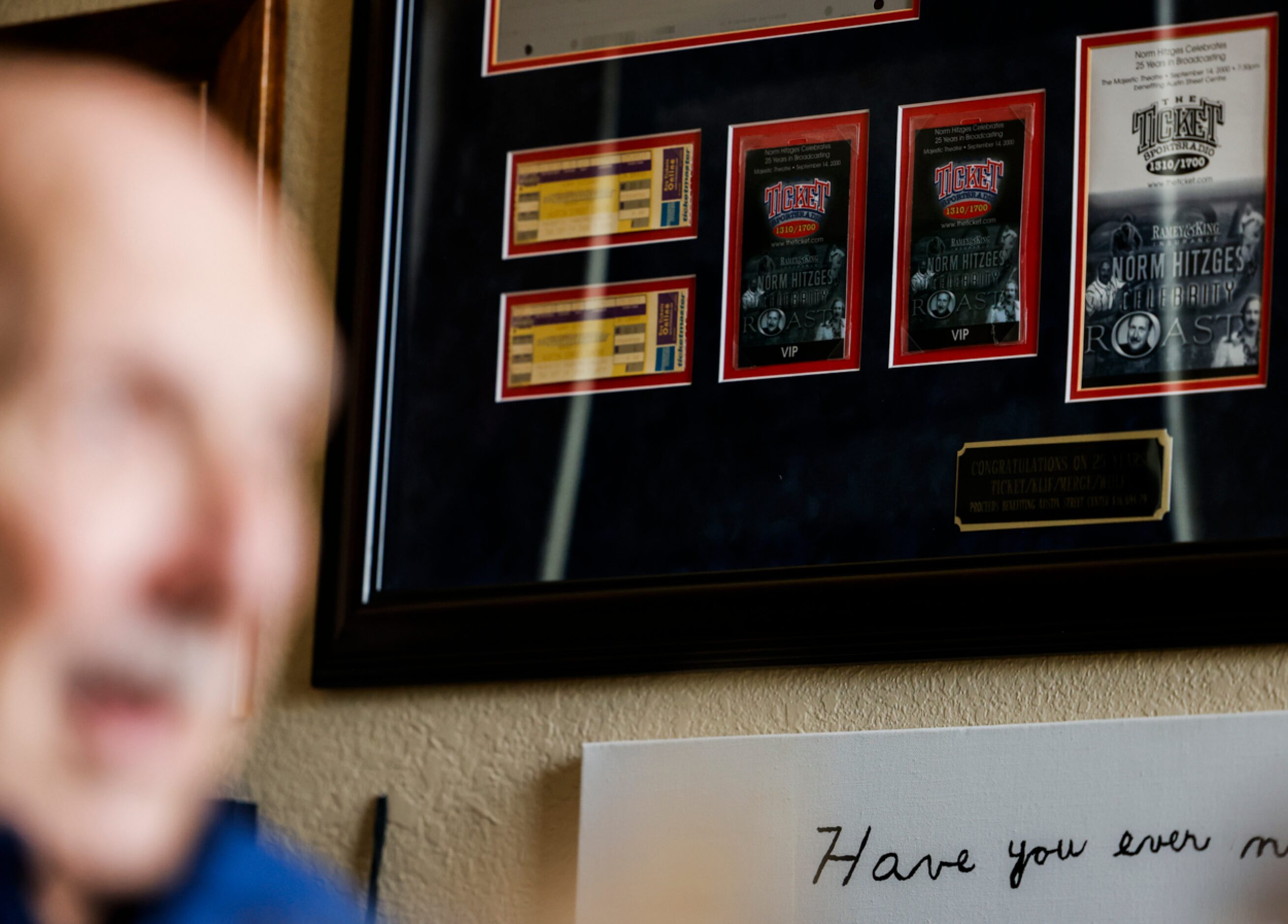 Memorabilia hangs on the wall of local sports radio legend 
Norm Hitzges’ office at his home...