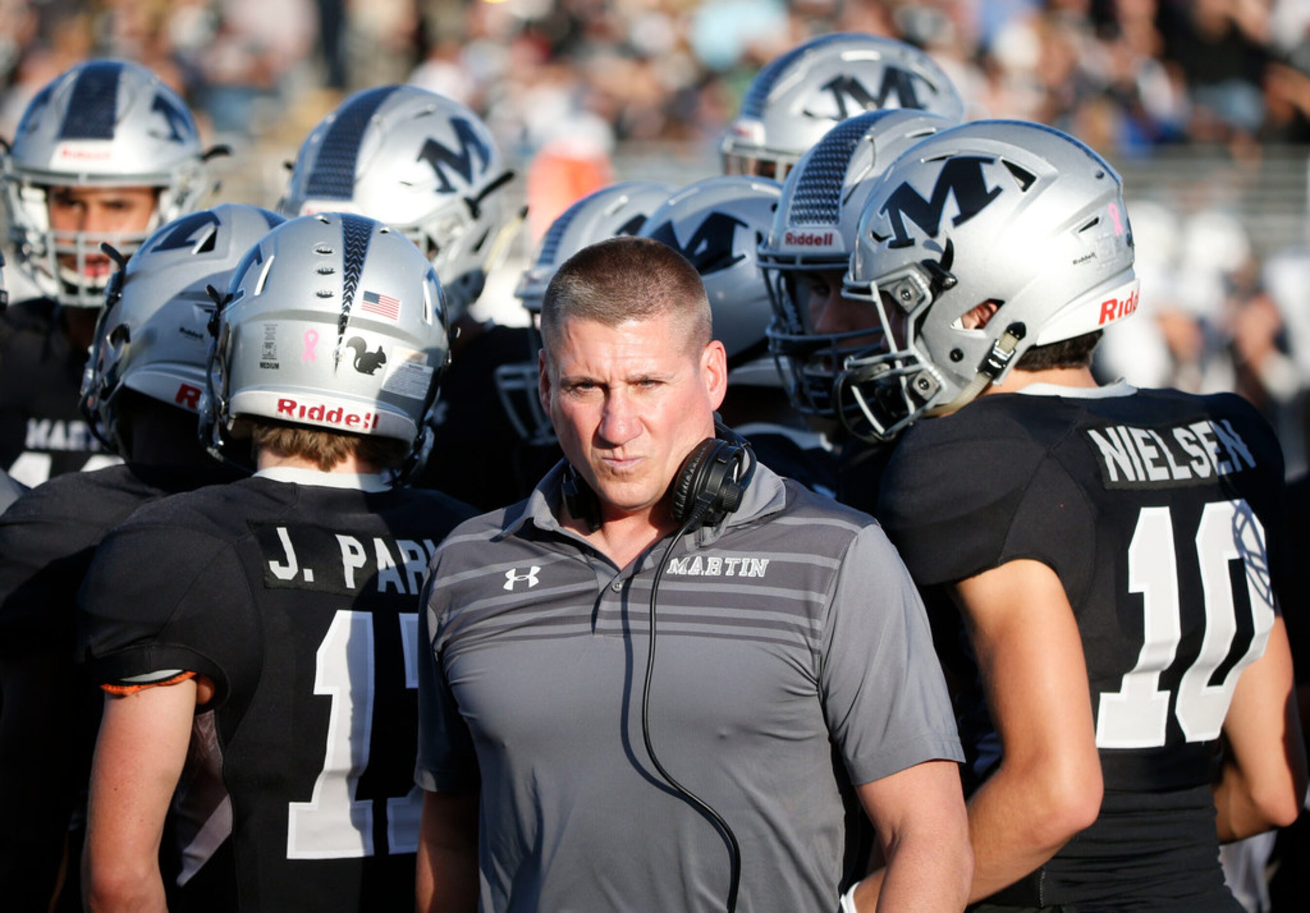 Arlington Martin football coach Bob Wager finishes talking to his team as they played Odessa...