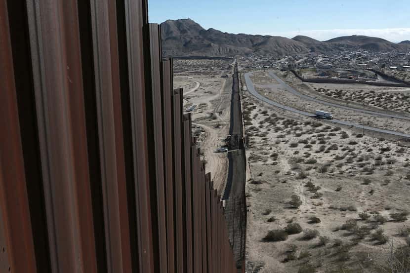 In this Wednesday, Jan. 25, 2017 file photo, a truck drives near the Mexico-US border fence,...