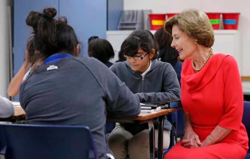 
Former first lady Laura Bush visited with Samantha Para (center) and other students at a...