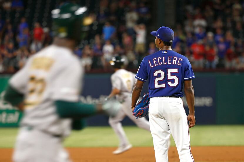 ARLINGTON, TX - JUNE 7: Jose Leclerc #25 of the Texas Rangers looks on after giving up a two...