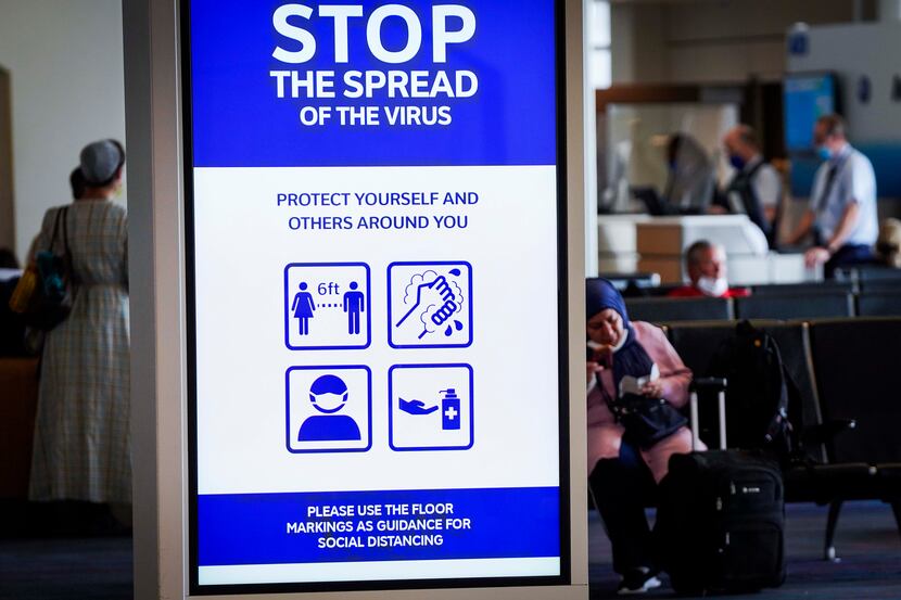 A message board displayed a public health notice of precautions against the spread of...