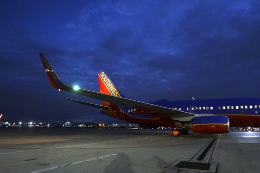 In this Nov. 13, 2014 photo, a Southwest Airlines originator flight pulls from the gate for...