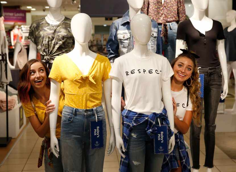 Twin sisters Bailey (left), and Brooklyn McKnight pose at an Arizona Jean Co. promotion...