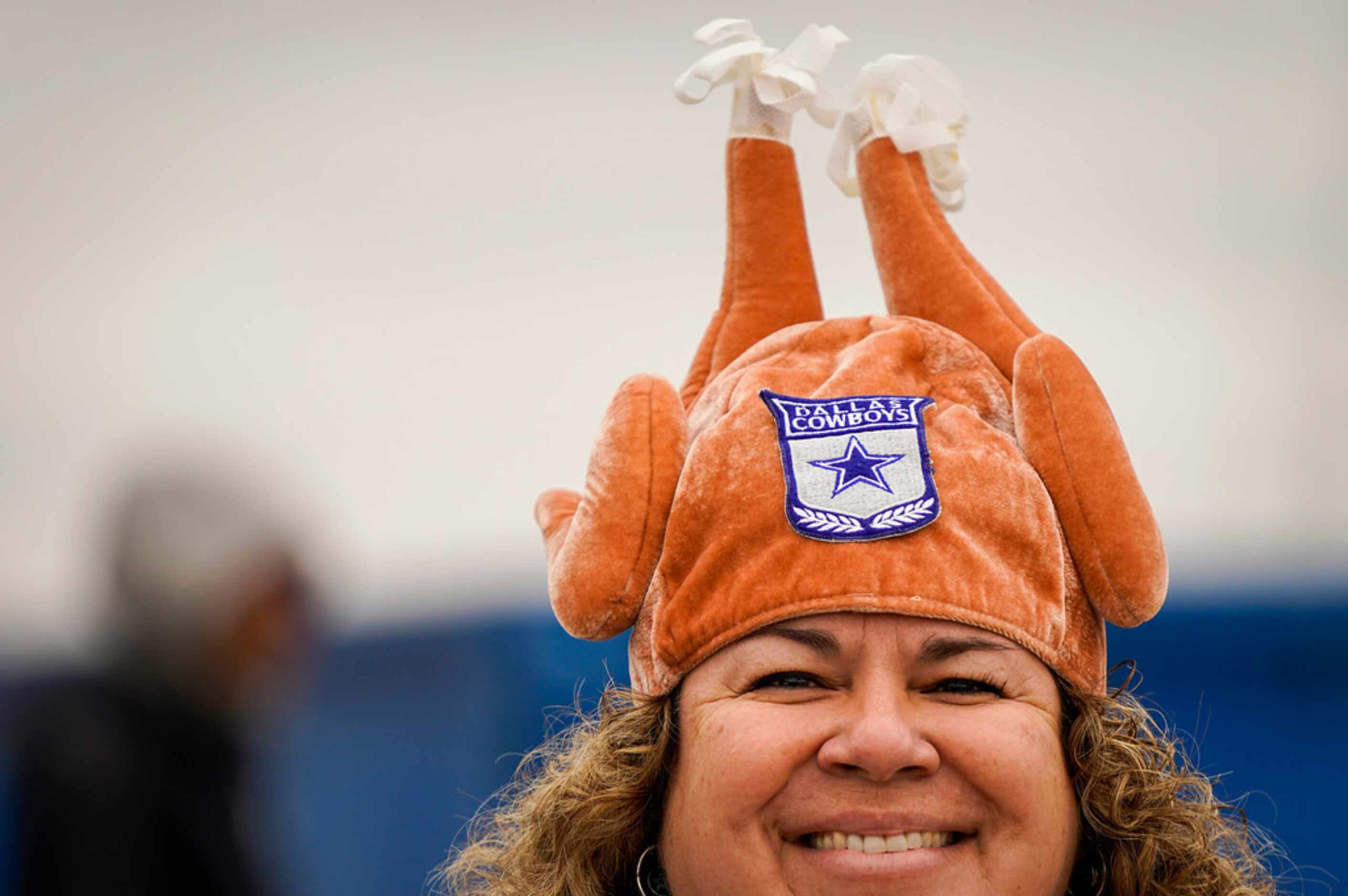 Barbara Weller of Flower Mound wears a turkey hat fas fans tailgate before an NFL football...