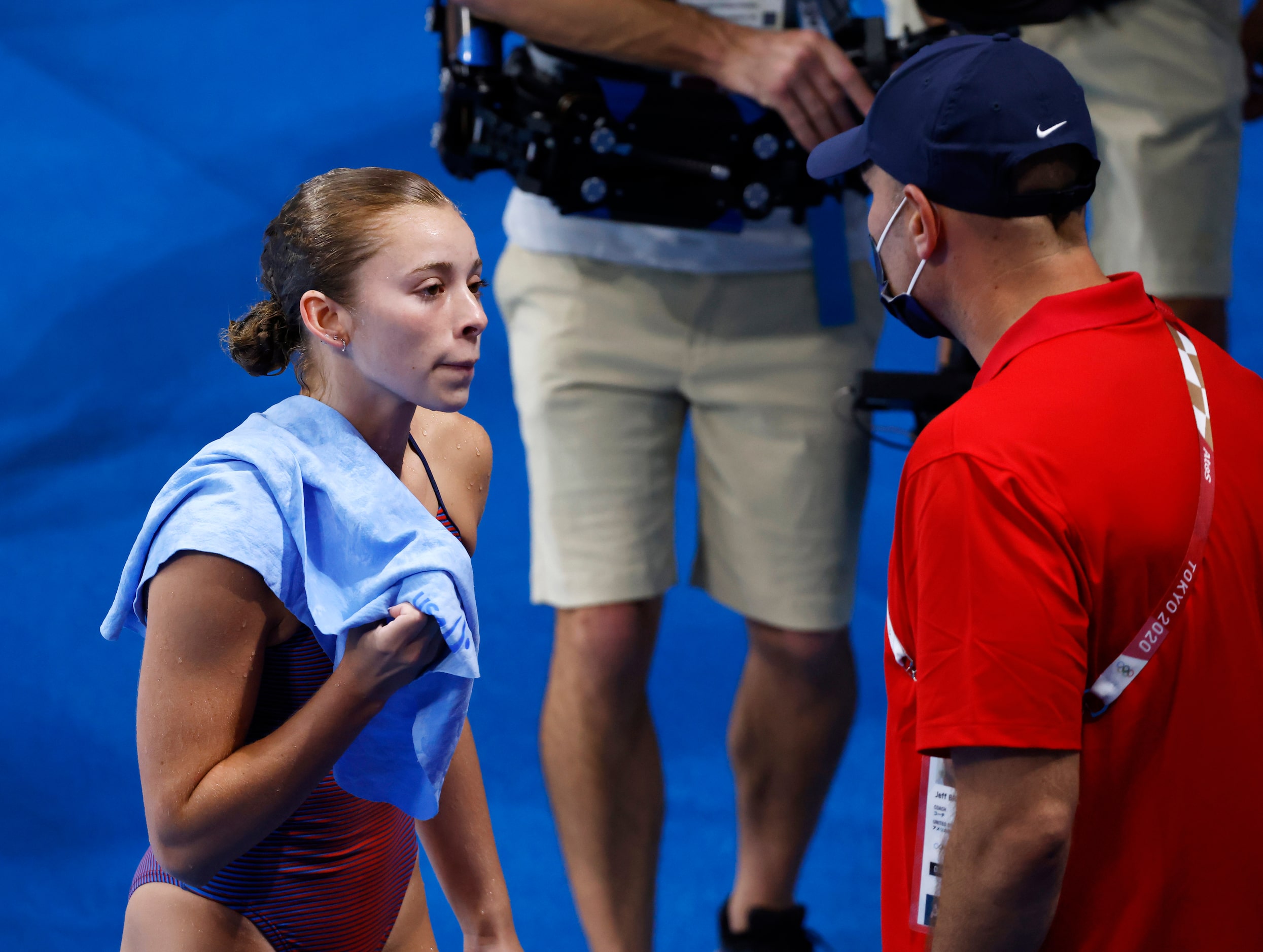 USA’s Hailey Hernandez talks to coach Jeff Bro after completing a dive in the women’s 3...