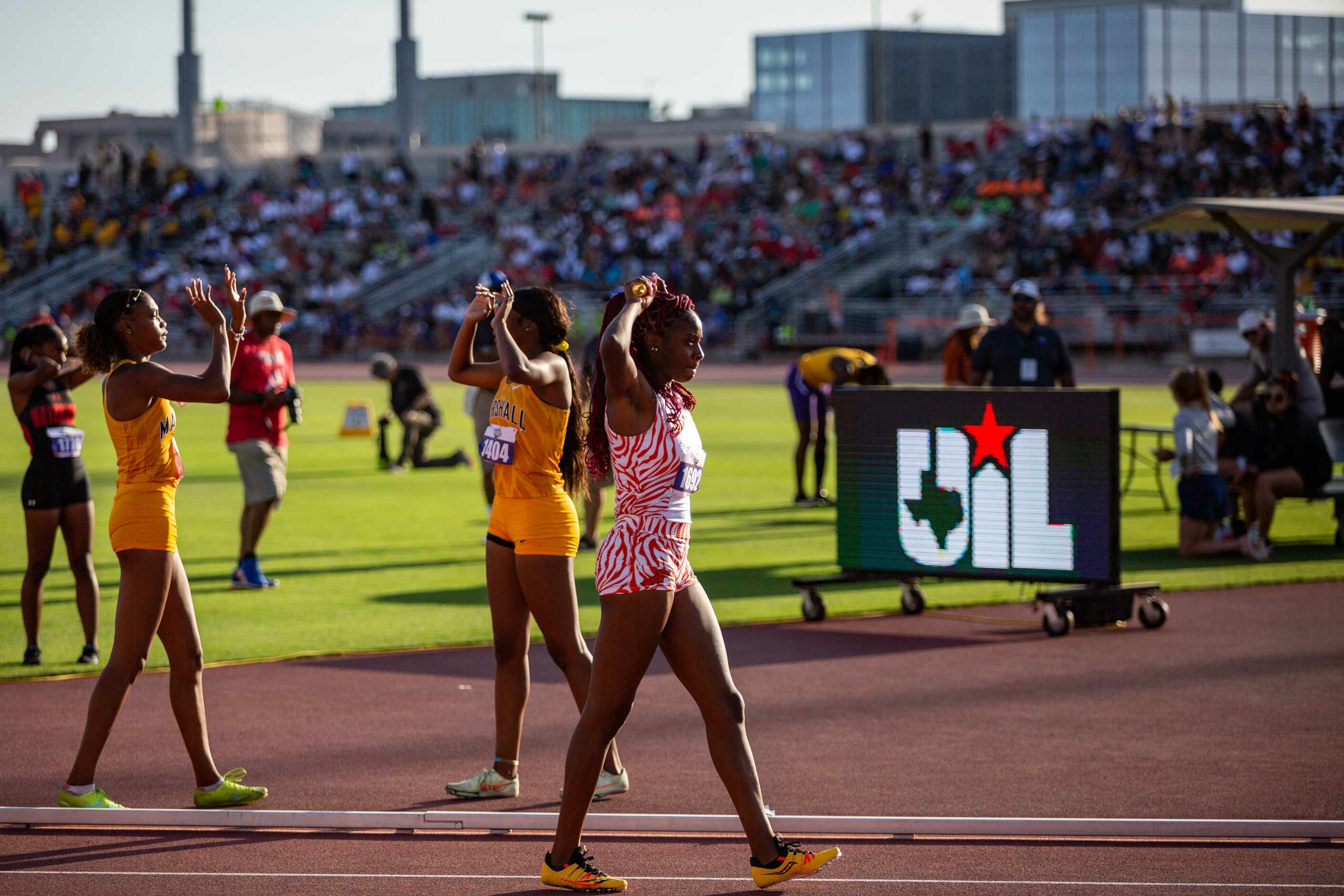 Lancaster’s Kelaiah Daniyan catches her breath after the girls’ 4x200 relay final at the UIL...