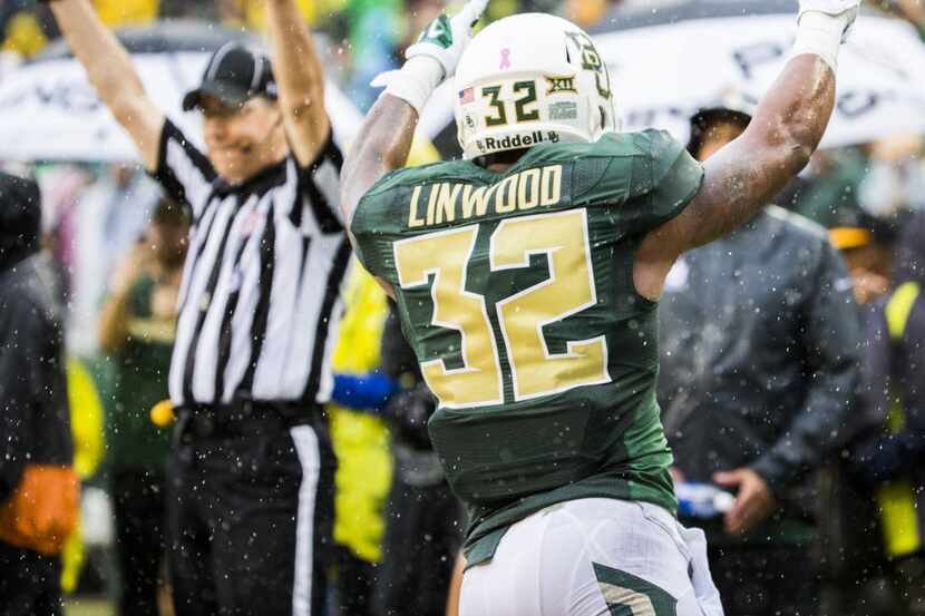 Baylor Bears running back Shock Linwood (32) celebrates after running in to the end zone for...