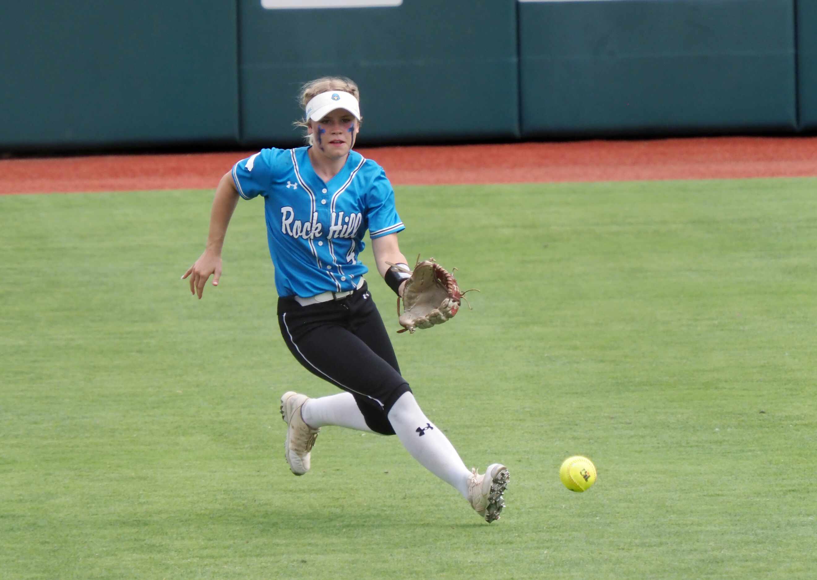 Prosper Rock Hill left fielder Leah Rinehart collects the ball against Montgomery Lake Creek...