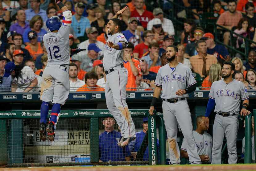 HOUSTON, TX - JUNE 13:  Rougned Odor #12 of the Texas Rangers receives a high five rom Elvis...