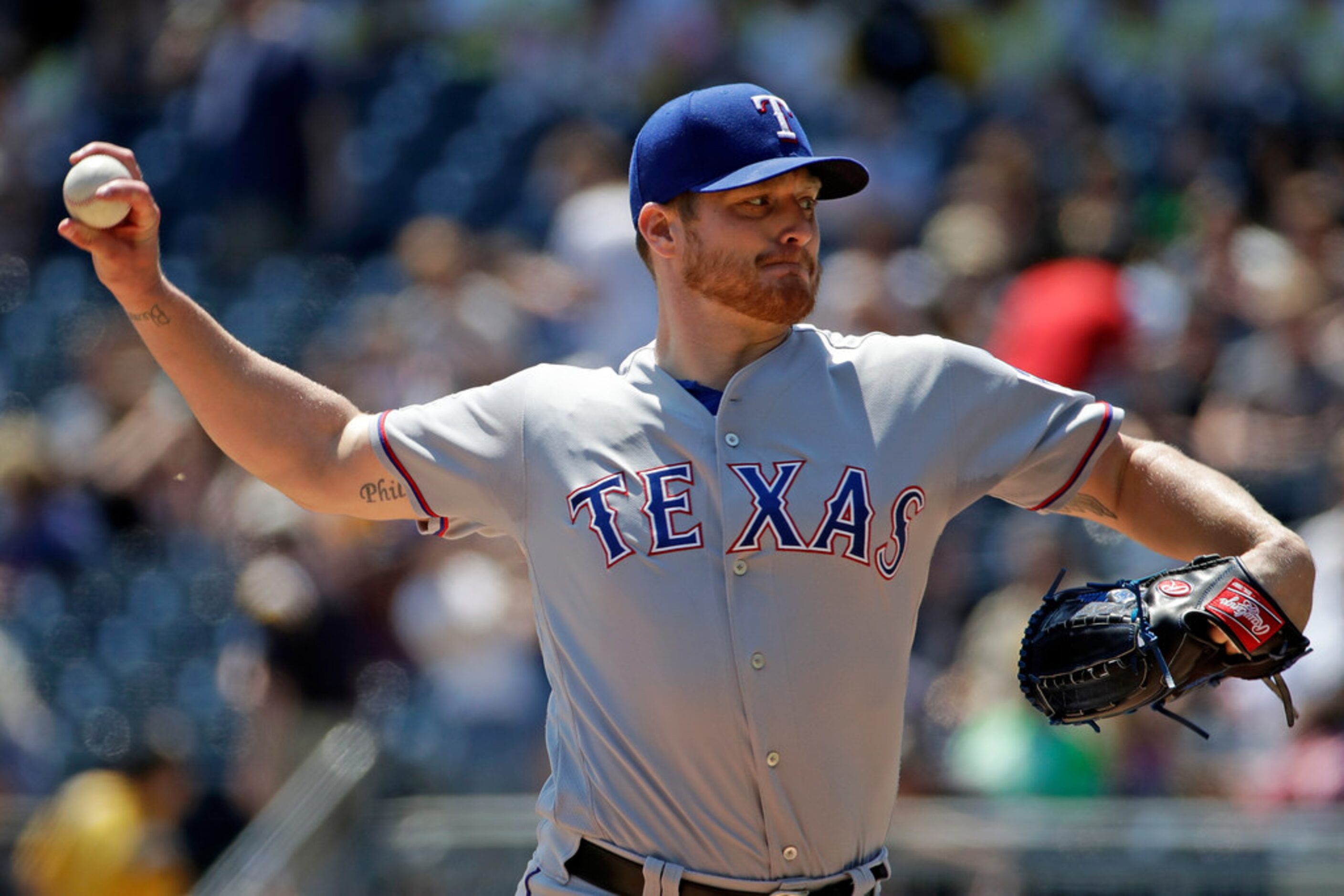 Texas Rangers starting pitcher Shelby Miller delivers during the first inning of a baseball...