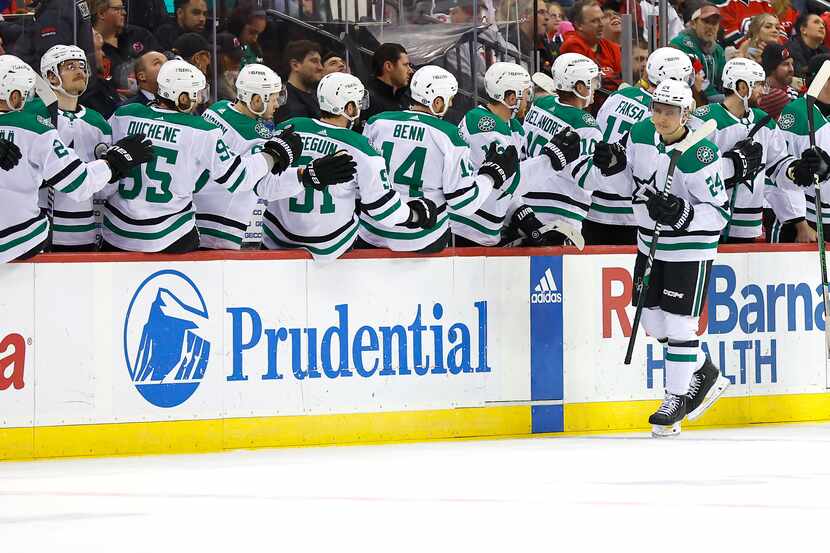 Dallas Stars center Roope Hintz (24) celebrates with teammates after scoring a goal against...