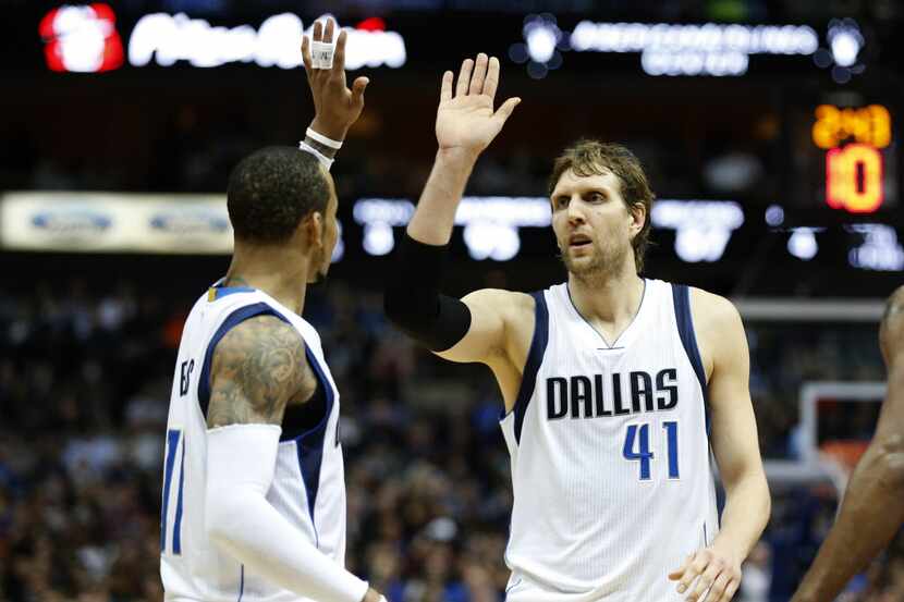 Mar 2, 2015; Dallas, TX, USA; Dallas Mavericks forward Dirk Nowitzki (41) celebrates with...