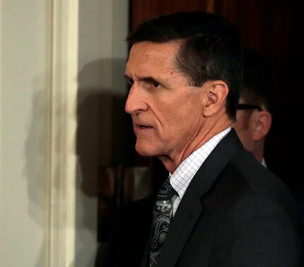 National Security Adviser Michael Flynn arrives in the East Room of the White House on...