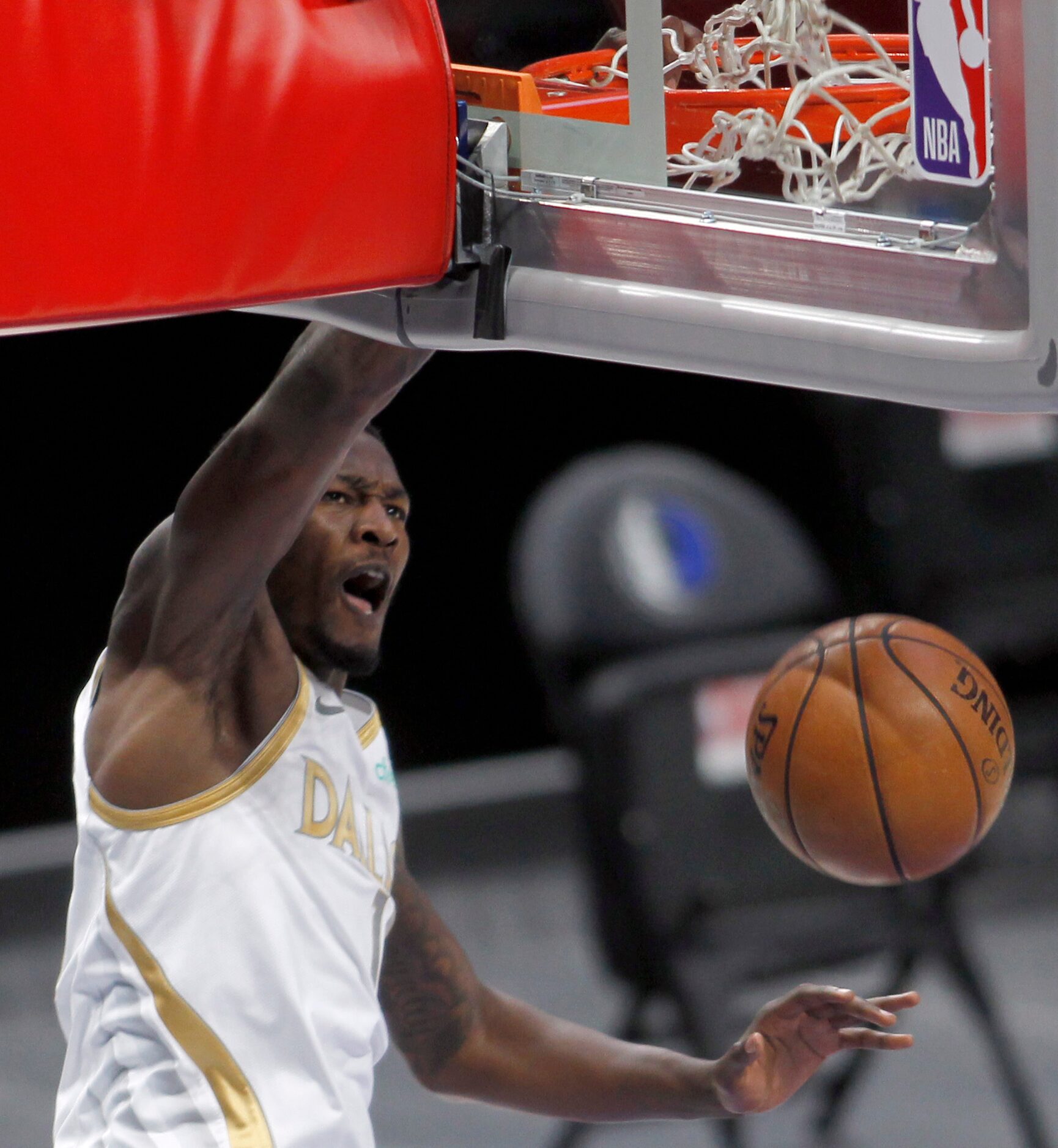 Dallas Mavericks forward Dorian Finney-Smith (10) powers down a dunk during first quarter...