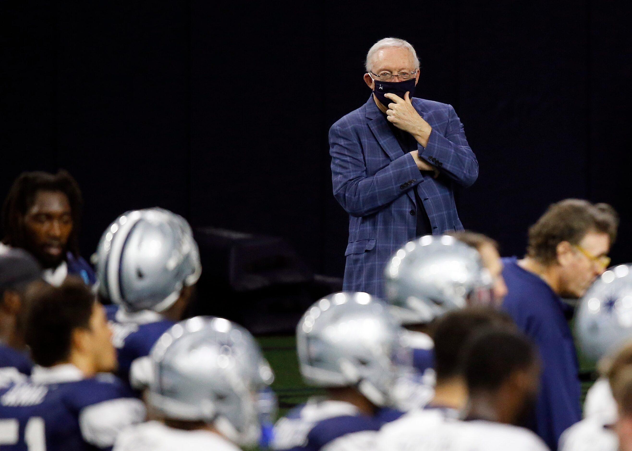 Dallas Cowboys owner and general manager Jerry Jones watches practice from the sidelines...