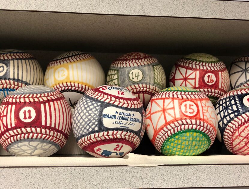 Baseballs painted by Bartolo Colon.