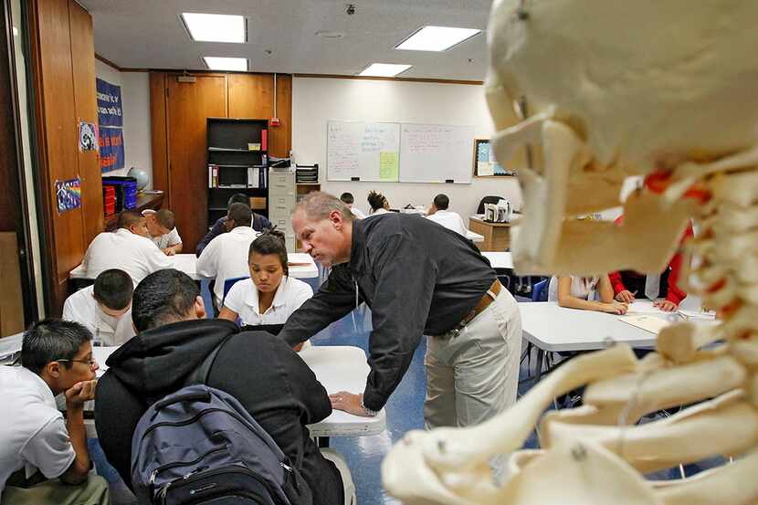  A teacher and students in a 9th grade Environment Science class at Dallas Can Academy in...