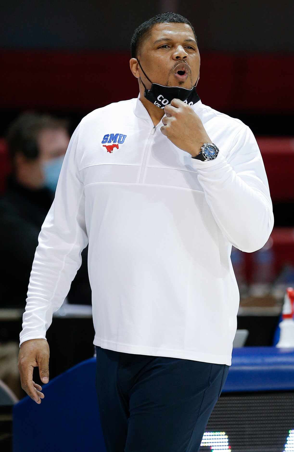 SMU assistant coach Yaphett King shouts instructions to his players during the first half of...