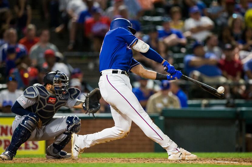 Texas Rangers center fielder Joey Gallo (13) hits a home run during the eighth inning of an...