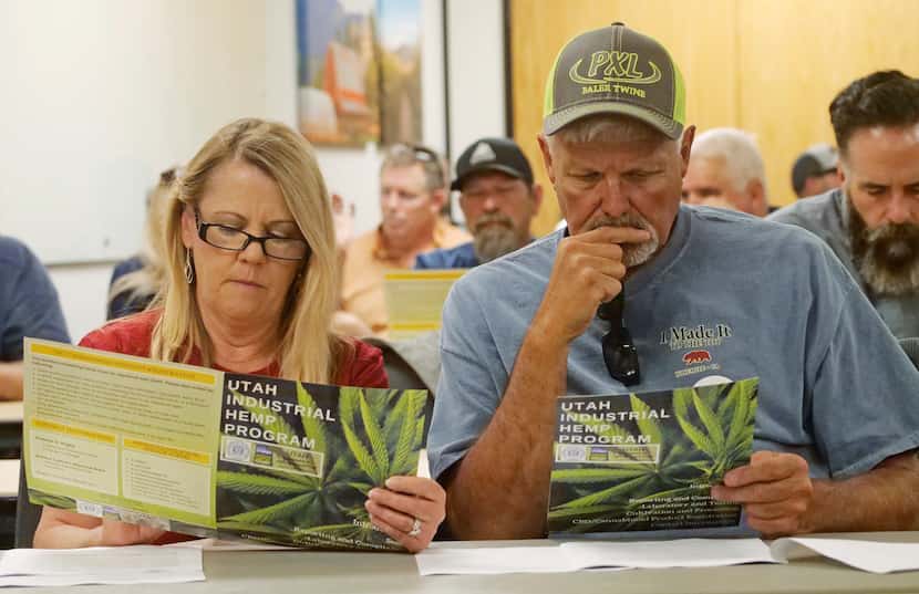 FILE - Alfalfa farmers Diane and Russ Jones look on during a public hearing on medical...