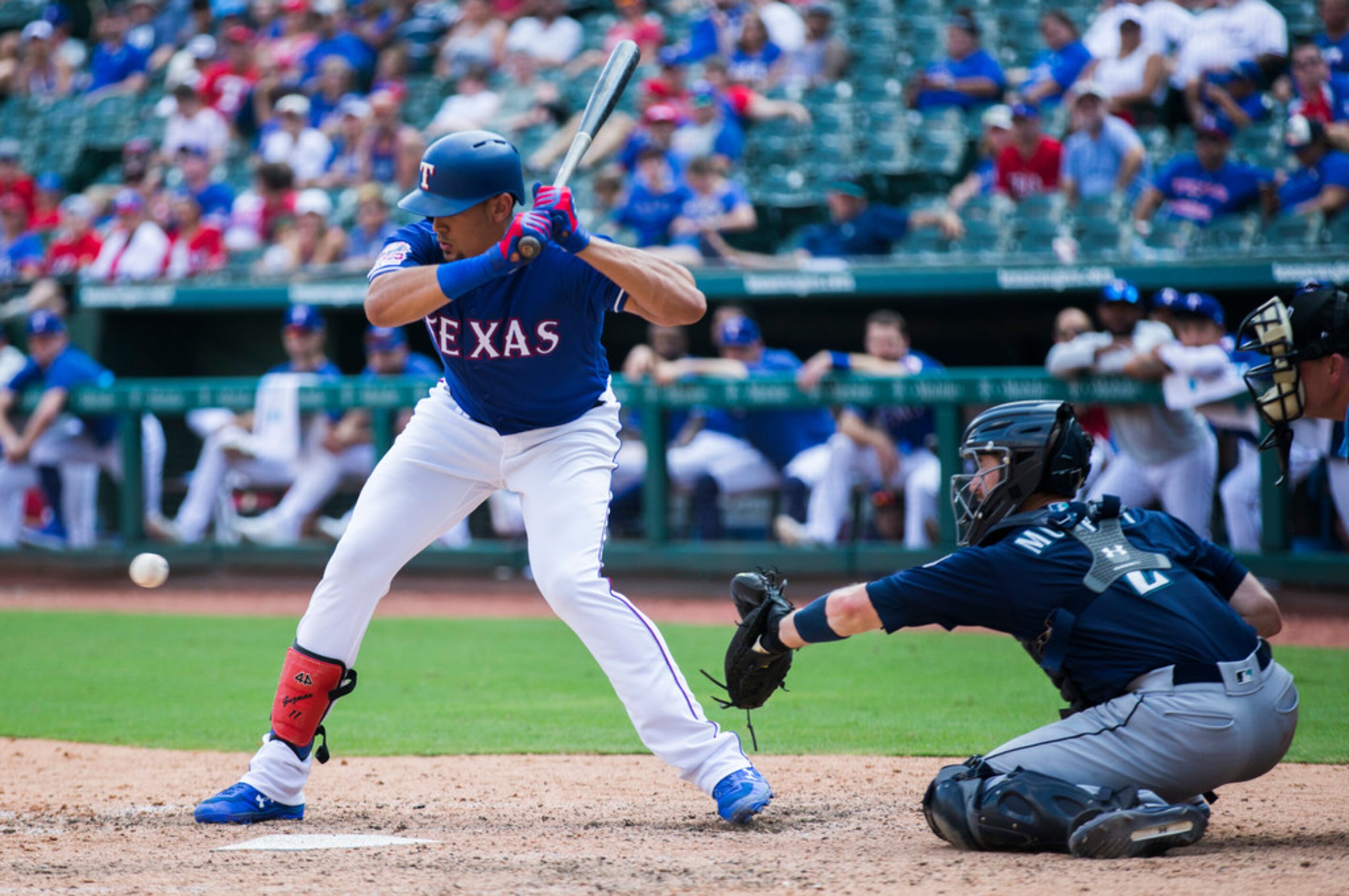 Texas Rangers first baseman Ronald Guzman (11) bats during the eighth inning of an MLB game...