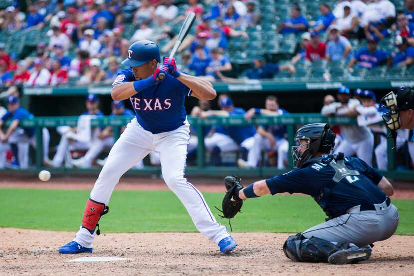 FILE - Rangers first baseman Ronald Guzman (11) bats during the eighth inning of a game...