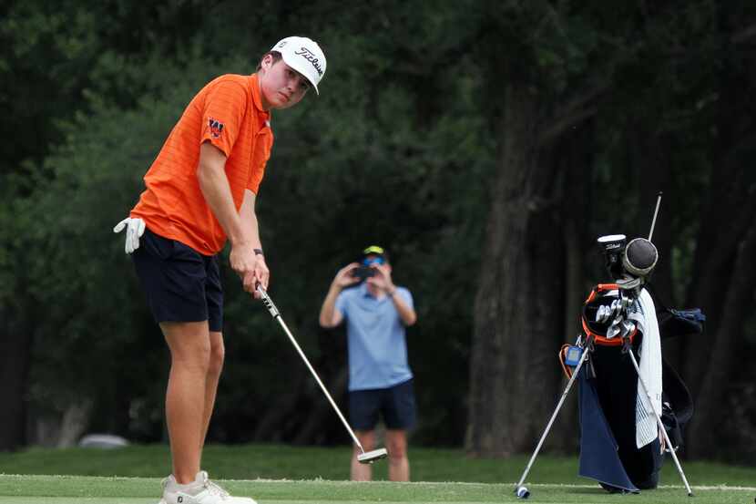 Frisco Wakeland’s Luke Colton putts on No. 18 to finish out round two of the UIL Boy’s High...