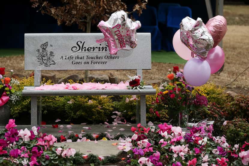 Mourners leave petals at a bench and in a garden dedicated to 3-year-old Sherin Mathews...