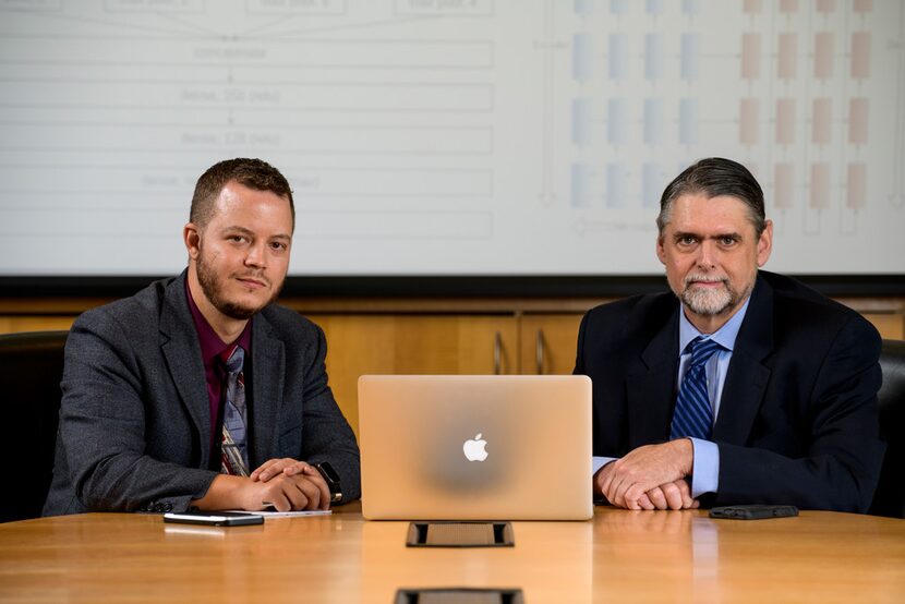 Southern Methodist University professors Eric Larson (left) and Mitchell Thornton sit in a...