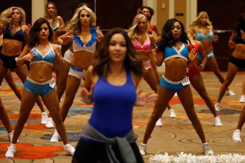 Dancers learn a routine taught by Elise Barrett (foreground) during Dallas Mavericks Dancers...