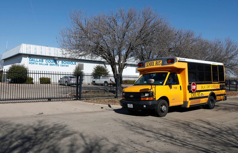 A Dallas County Schools bus driver prepares to leave Monday from one of four bus depots...