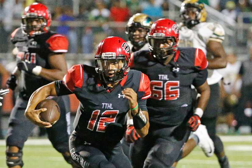 Cedar Hill quarterback Avery Davis (12) is pictured in action during the DeSoto High School...