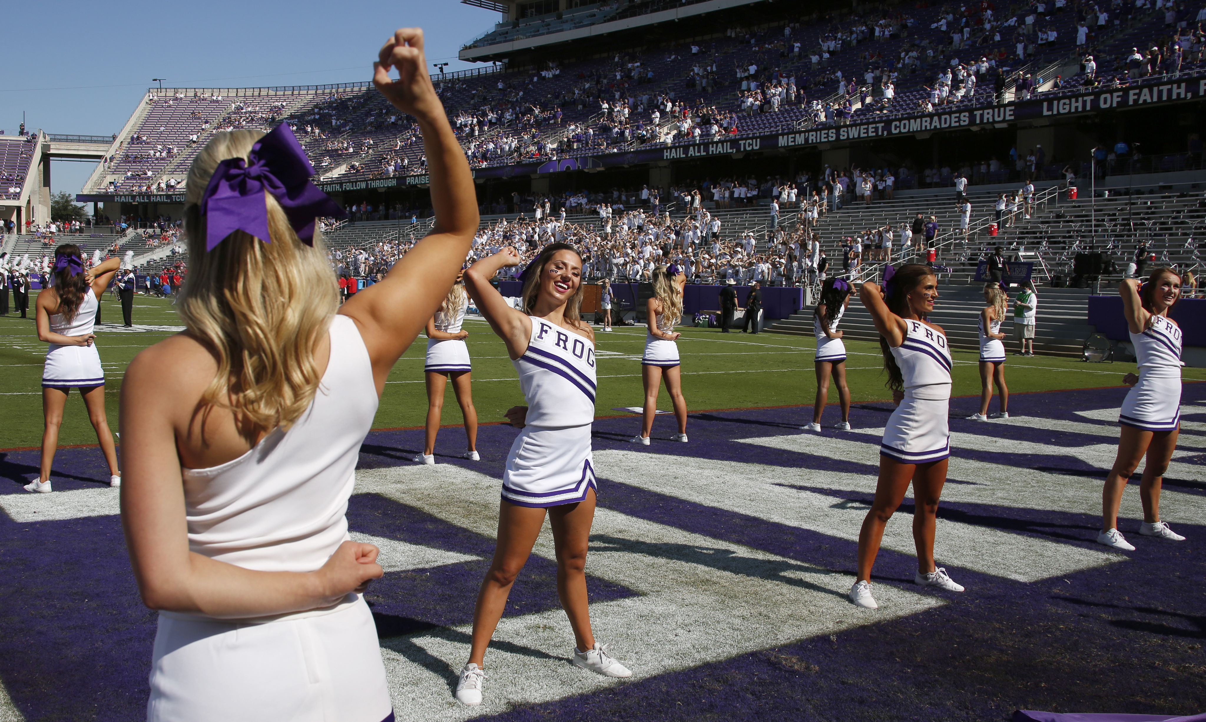 TCU cheerleaders work to ignite fans from an end zone prior to the opening kickoff in which...