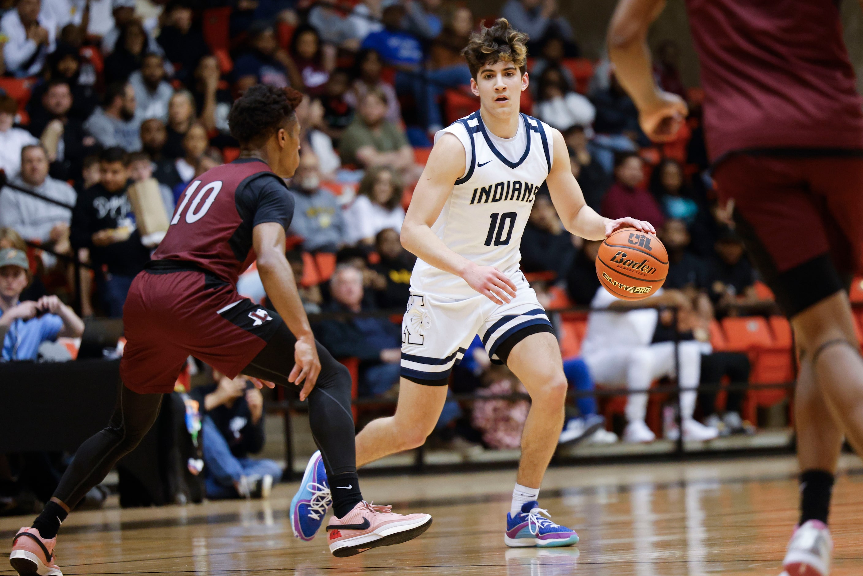 Lewisville High’s Princeton Green (10) follows as Keller high’s Steven Ramirez dribbles...