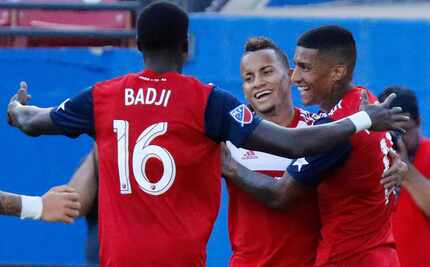 FC Dallas forward Dominique Badji (16) embraces FC Dallas midfielder Michael Barrios (21)...