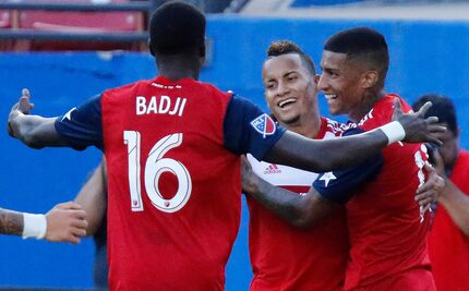 FC Dallas forward Dominique Badji (16) embraces FC Dallas midfielder Michael Barrios (21)...