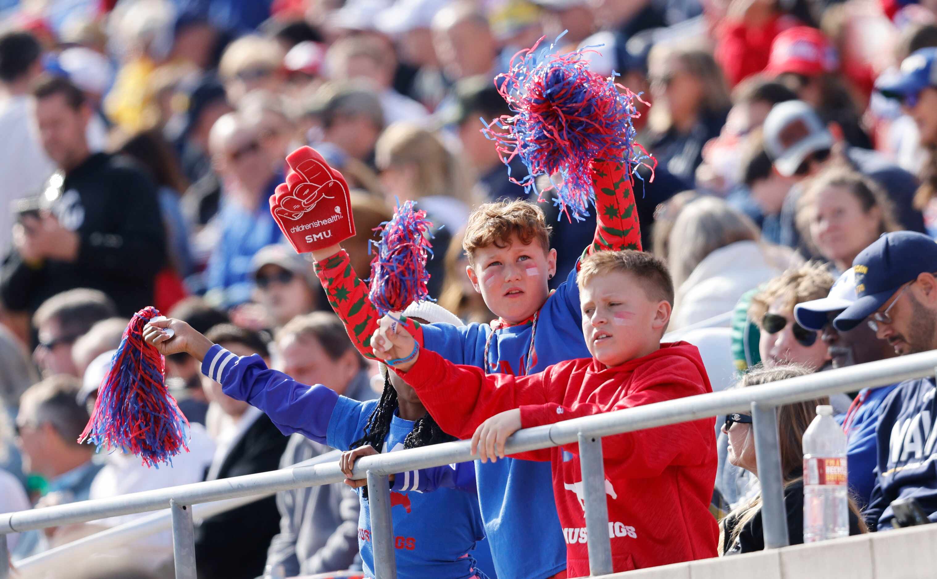 SMU fans cheer during the first half of an NCAA college football game against the Navy at...