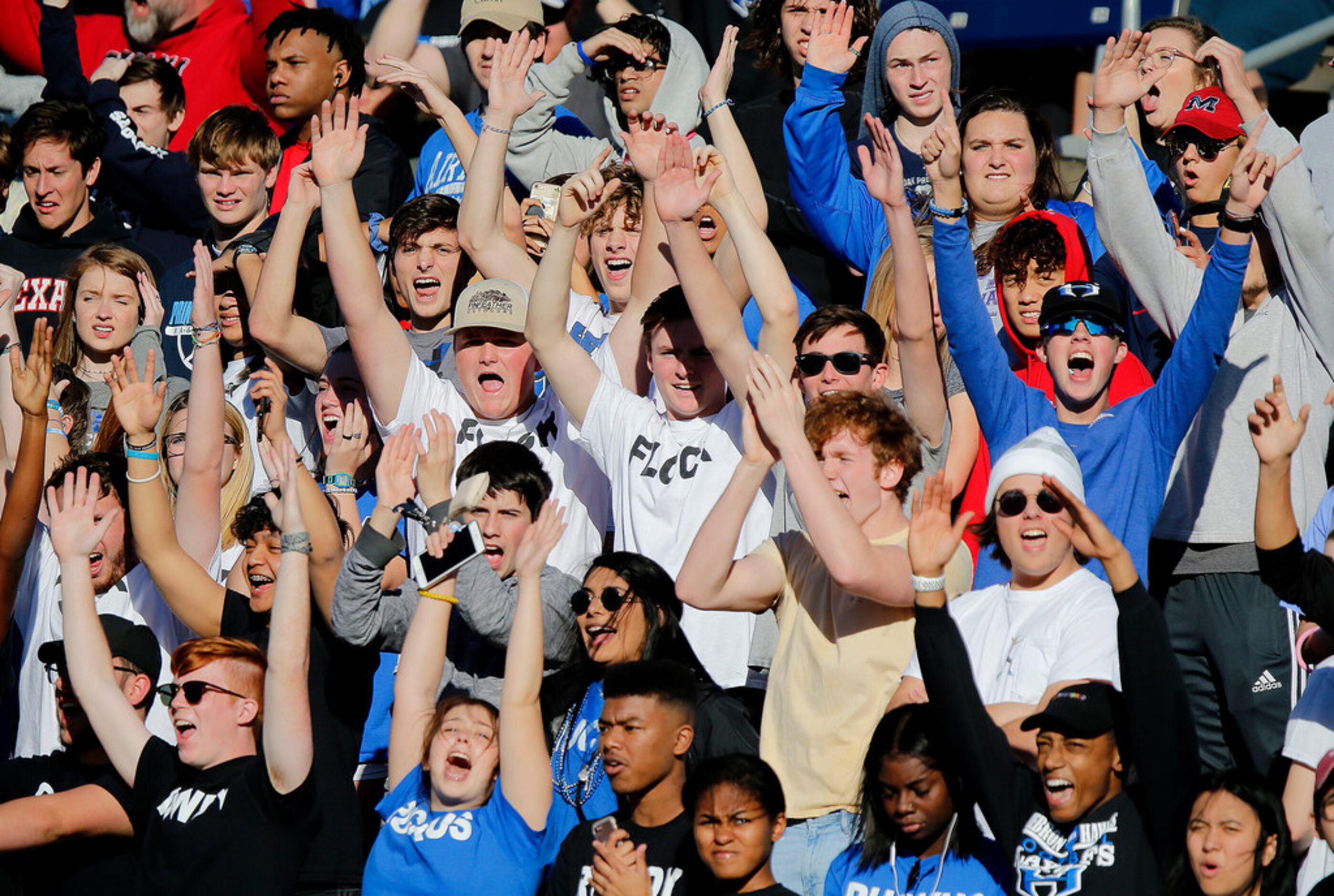 The Hebron High School student section reacts to a touchdown late in the third quarter as...