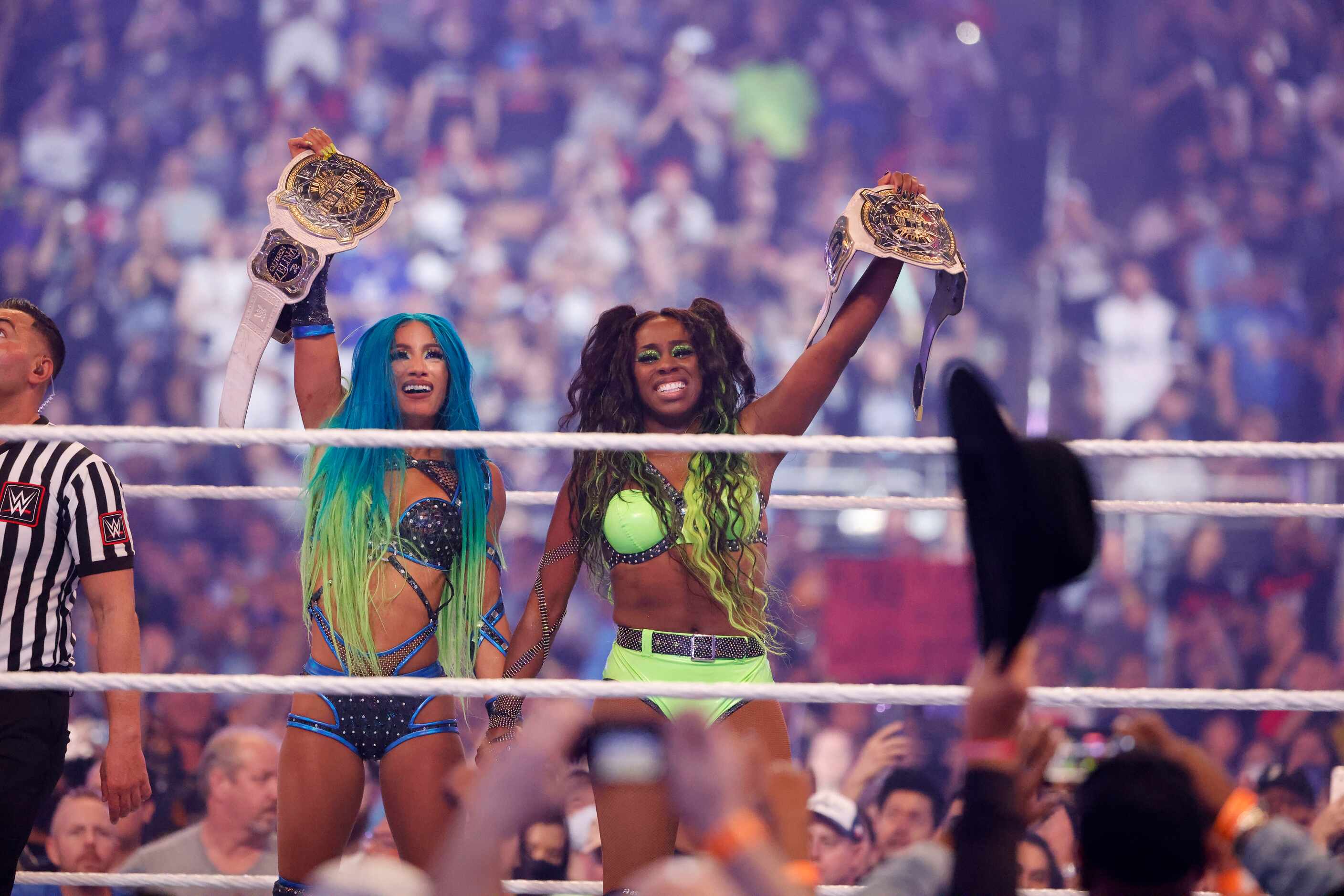Sasha Banks and Naomi celebrate winning the Women’s tag team championship during...