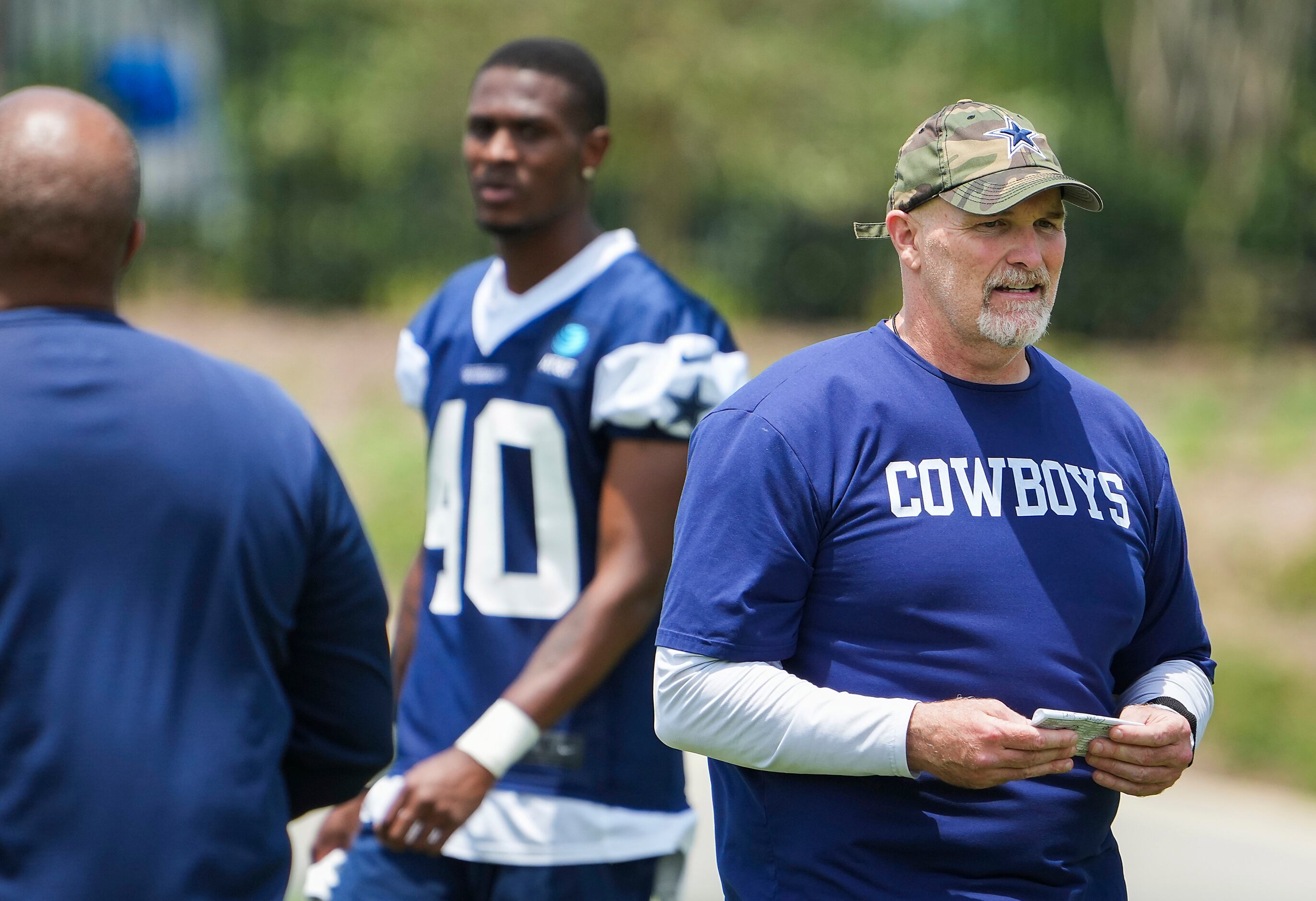 Dallas Cowboys defensive coordinator Dan Quinn watches his team during a minicamp practice...