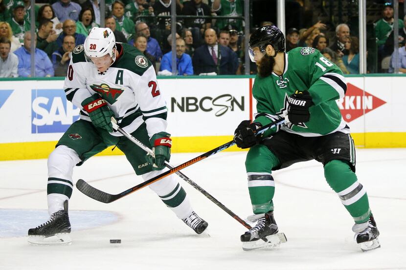 Dallas Stars right wing Patrick Eaves (18) tries to backhand a shot against the Minnesota...