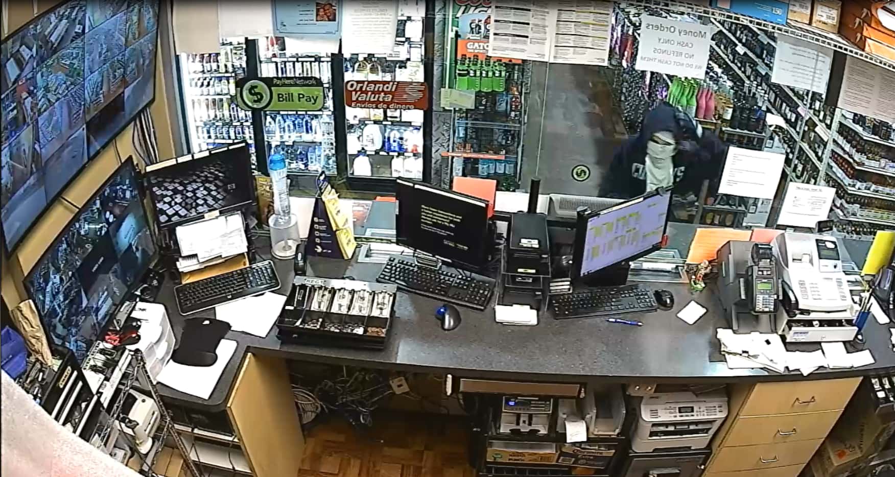 Police released surveillance footage Thursday of the two males they said went into the store...