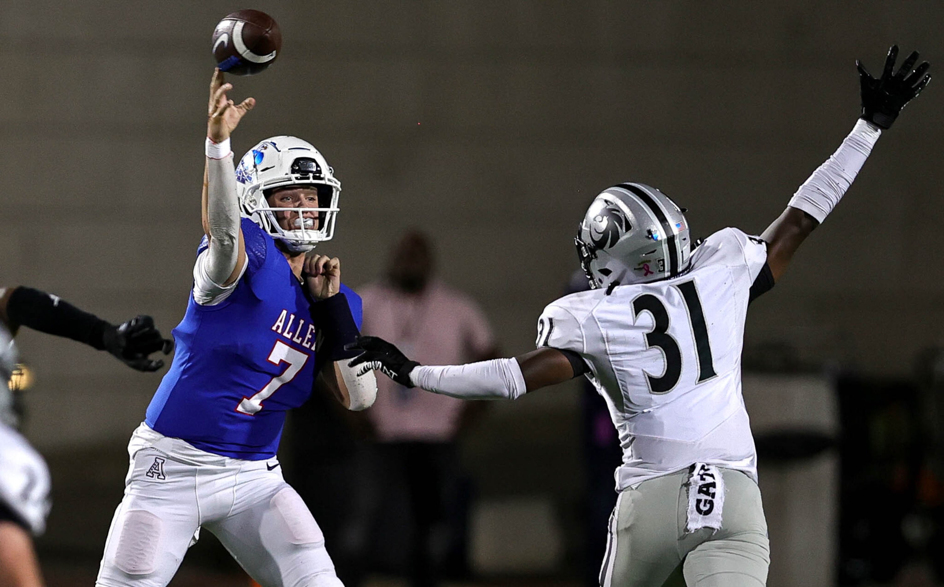 Allen quarterback Brady Bricker (7) attempts a pass over Denton Guyer linebacker Jayden...