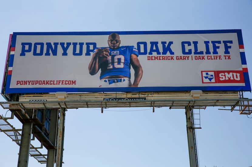 A billboard at the corner of I-35E and Illinois Avenue features Demerick Gary, a Kimball...