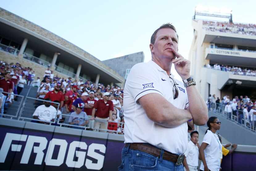 TCU baseball coach Jim Schlossnagle watches from the sidelines in the first quarter during...
