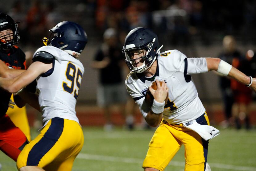 Highland Park quarterback Chandler Morris (4) finds an opening and heads to the end zone for...