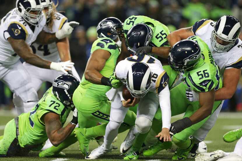 Los Angeles Rams quarterback Jared Goff (16) is sacked by Seattle Seahawks' Cliff Avril...