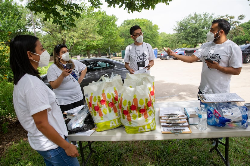 Ramiro Luna-Hinojosa (right) speaks to members of Somos Tejas at Martin Weiss Park before...